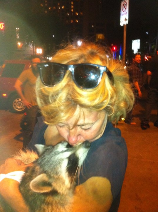 This is a picture that Aaron took of a woman carrying a dead raccoon around downtown.
